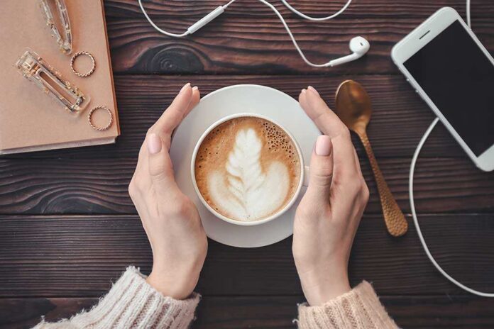 Woman,Drinking,Tasty,Cappuccino,At,Wooden,Table