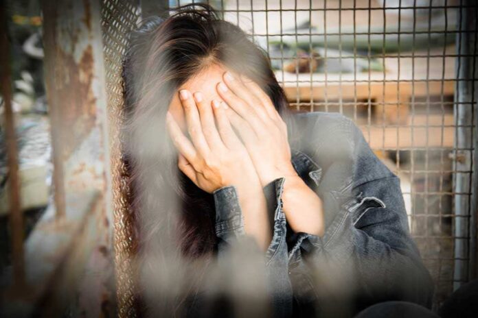 Woman,In,The,Cage,,Human,Trafficking,Concept,blurry,Portrait