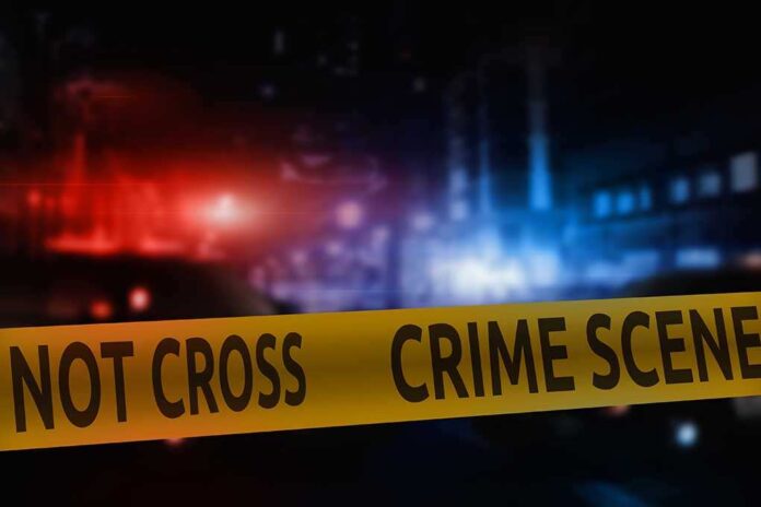 Crime,Scene,Tape,On,The,Background,Of,Night,City,Lights