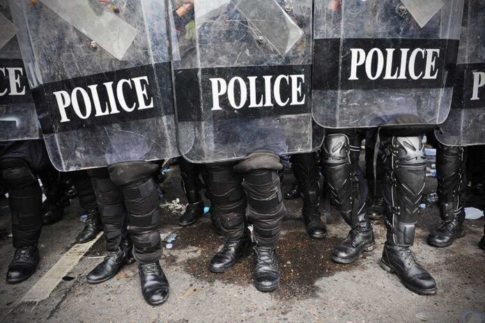 Police,In,Riot,Gear,Background