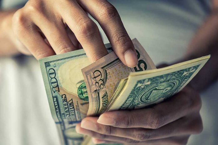 Close-up,Hands,Counting,Money,American,Dollars,,,Counting,Money,American