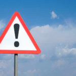Triangular warning sign with exclamation mark