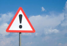 Triangular warning sign with exclamation mark