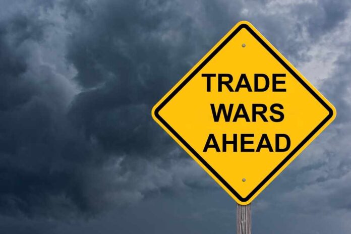 shutterstock_2578020029.jpg featured image Yellow warning sign reads Trade Wars Ahead