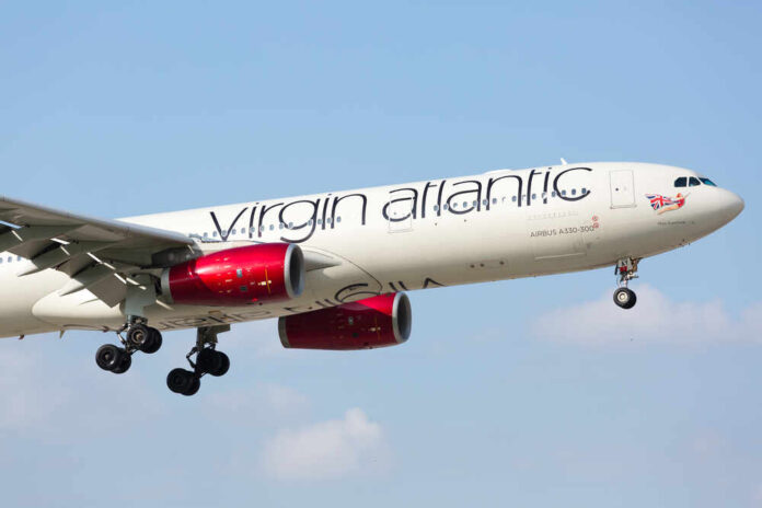 shutterstock_537981169.jpg featured image Virgin Atlantic plane flying in clear blue sky