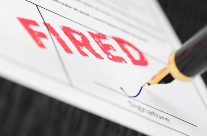 shutterstock_761289151.jpg featured image Fountain pen signing document with the word fired