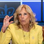 Jill Biden yellow speaking and gesturing with hand