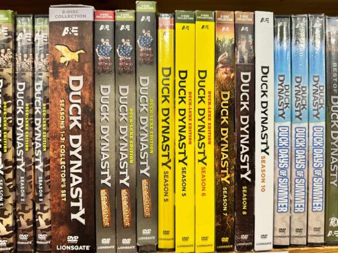 shutterstock_2532253591.jpg featured image Assorted Duck Dynasty DVDs on a shelf