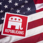Republican party logo on American flag background.