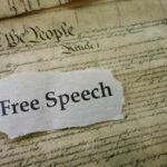 U.S. Constitution with Free Speech text overlay.