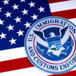 Colorado Terrorism Suspect’s FAMILY Arrested by ICE US Immigration and Customs Enforcement badge on flag
