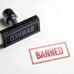 Trump BANS Entry for Citizens of 12 Countries! Banned rubber stamp and stamped text on paper