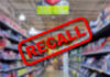 Blurred store aisle with RECALL stamp overlay