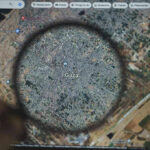 Magnifying glass highlighting Gaza on Google Maps