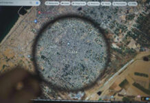 Magnifying glass highlighting Gaza on Google Maps