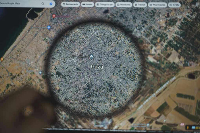 Magnifying glass highlighting Gaza on Google Maps