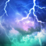 Lightning bolts in a colorful stormy sky
