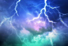 Lightning bolts in a colorful stormy sky