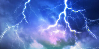 Lightning bolts in a colorful stormy sky