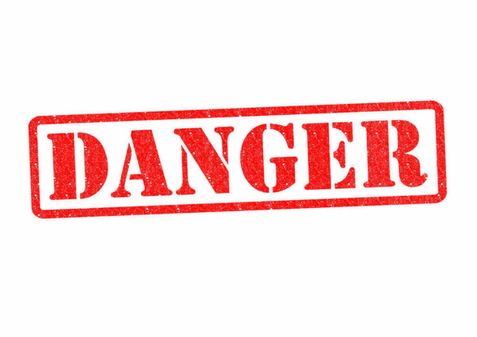 shutterstock_142860013.jpg Red danger stamp on white background