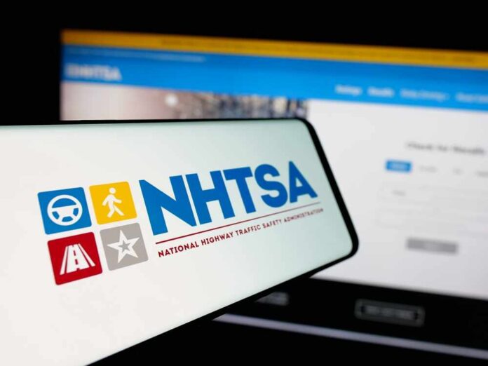 shutterstock_2583823089.jpg featured image NHTSA logo displayed on a smartphone screen