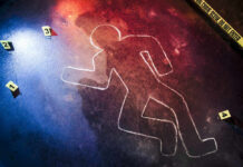 Crime scene chalk outline with numbered evidence markers