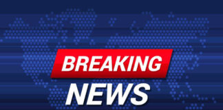 Breaking News text on world map background