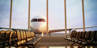 Airplane viewed from an empty airport waiting area
