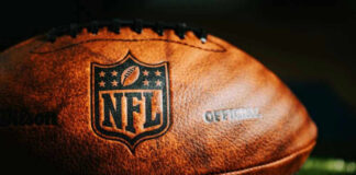 Close-up of an NFL football on grass