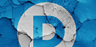 Democrat Party logo on a cracked, peeling surface.