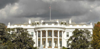 The White House with dark clouds overhead