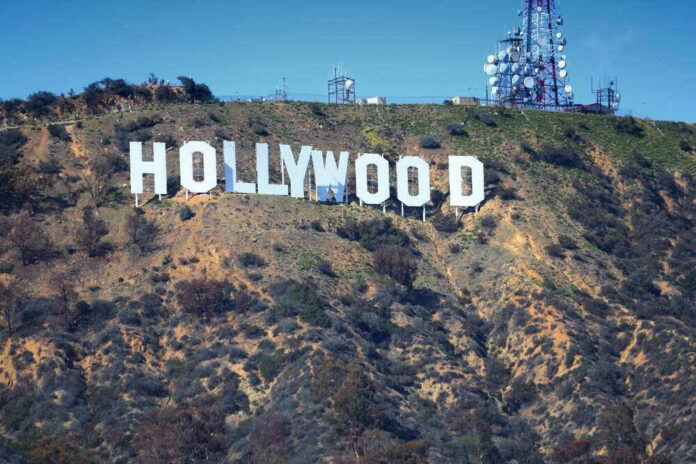 Hollywood sign on hillside with communication towers