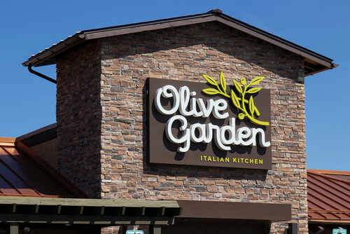Olive Garden restaurant sign on a stone building