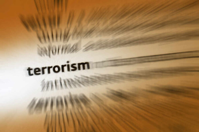 Blurred text with the word 'terrorism' in focus