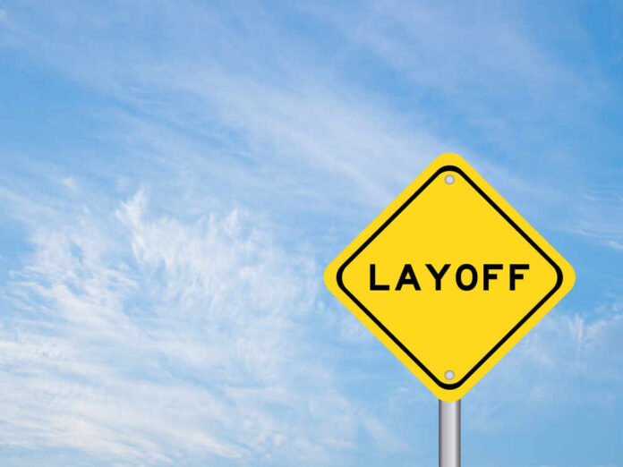 Yellow warning sign displaying the word 'LAYOFF'