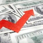 Massive Premium Shock Hits Millions A red arrow indicating growth over scattered hundred dollar bills