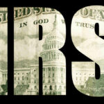 IRS SLASHED 26% — Filing Season CHAOS Looms IRS letters with US Capitol building inside.