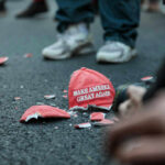 Trump’s National Guard Withdrawal Shocks MAGA Shattered Make America Great Again hat on the ground