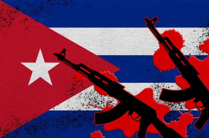 Cuban flag with silhouettes of guns and red splashes