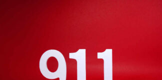 White numbers 911 on a red background