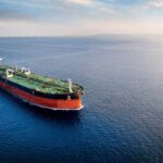 An oil tanker navigating through calm ocean waters