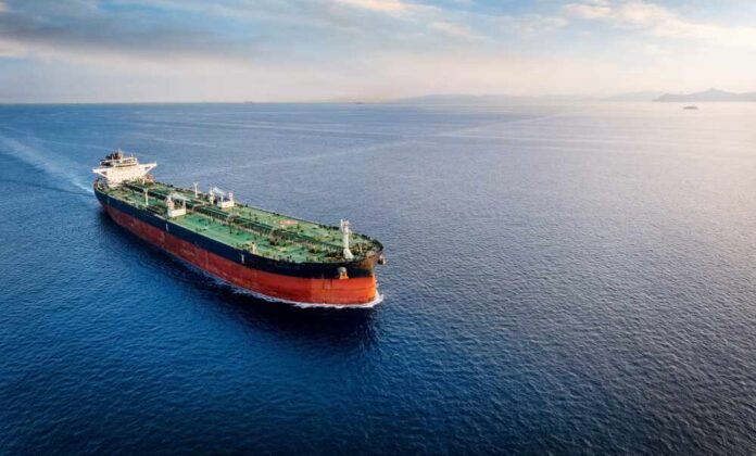 An oil tanker navigating through calm ocean waters