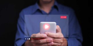 Person holding a smartphone with a live streaming interface