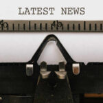 Revolutionary TV — Nobody Expected THIS Close-up of a typewriter with a sheet of paper displaying the words 'LATEST NEWS'