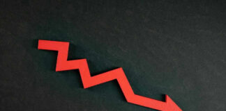 Red zigzag arrow pointing down on dark background.