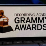 Grammys Epstein ‘Joke’ SPARKS Trump Threat Grammy Awards logo on a smartphone screen.