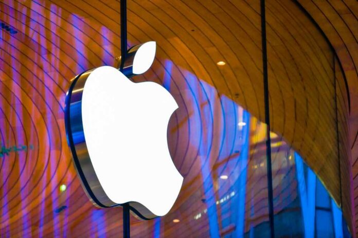 Illuminated Apple logo against a wooden backdrop