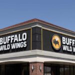 Exterior view of a Buffalo Wild Wings restaurant with a clear blue sky