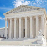 Supreme Court Wildcard Threatens Claims United States Supreme Court building with statues and columns.