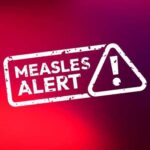 Measles Surge Slams World Cup Measles alert warning sign with exclamation mark